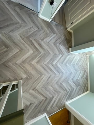 Herringbone LVT staircase landing