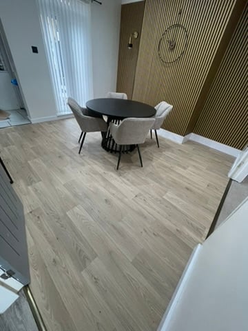 Light plank vinyl dining area