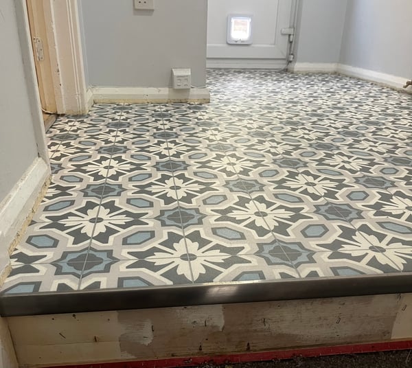 Patterned tile-effect vinyl hallway