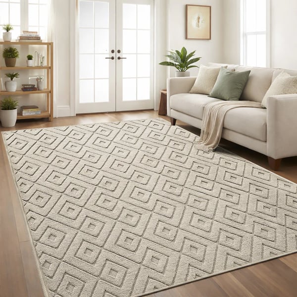 Light patterned rug in a bright living room with a cream sofa