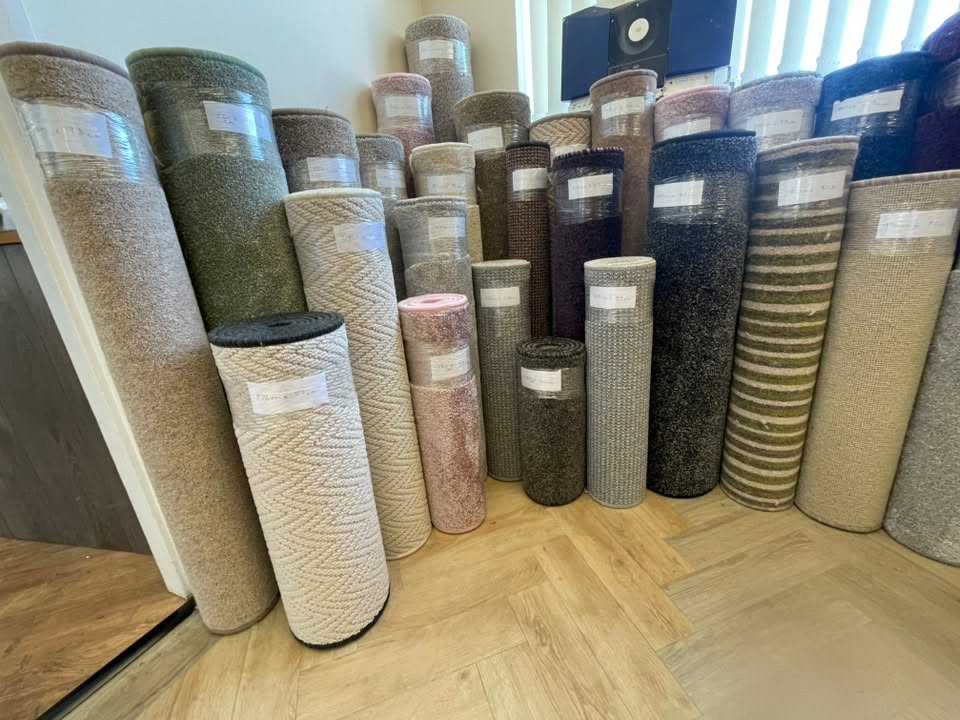 Rows of carpet rolls in the Cefn Carpets showroom